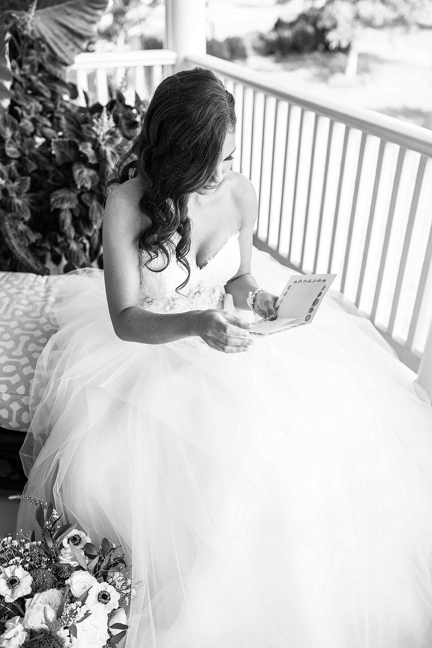 bride opens gift on wedding day with Maryland wedding photographer Alexandra Mandato Photography