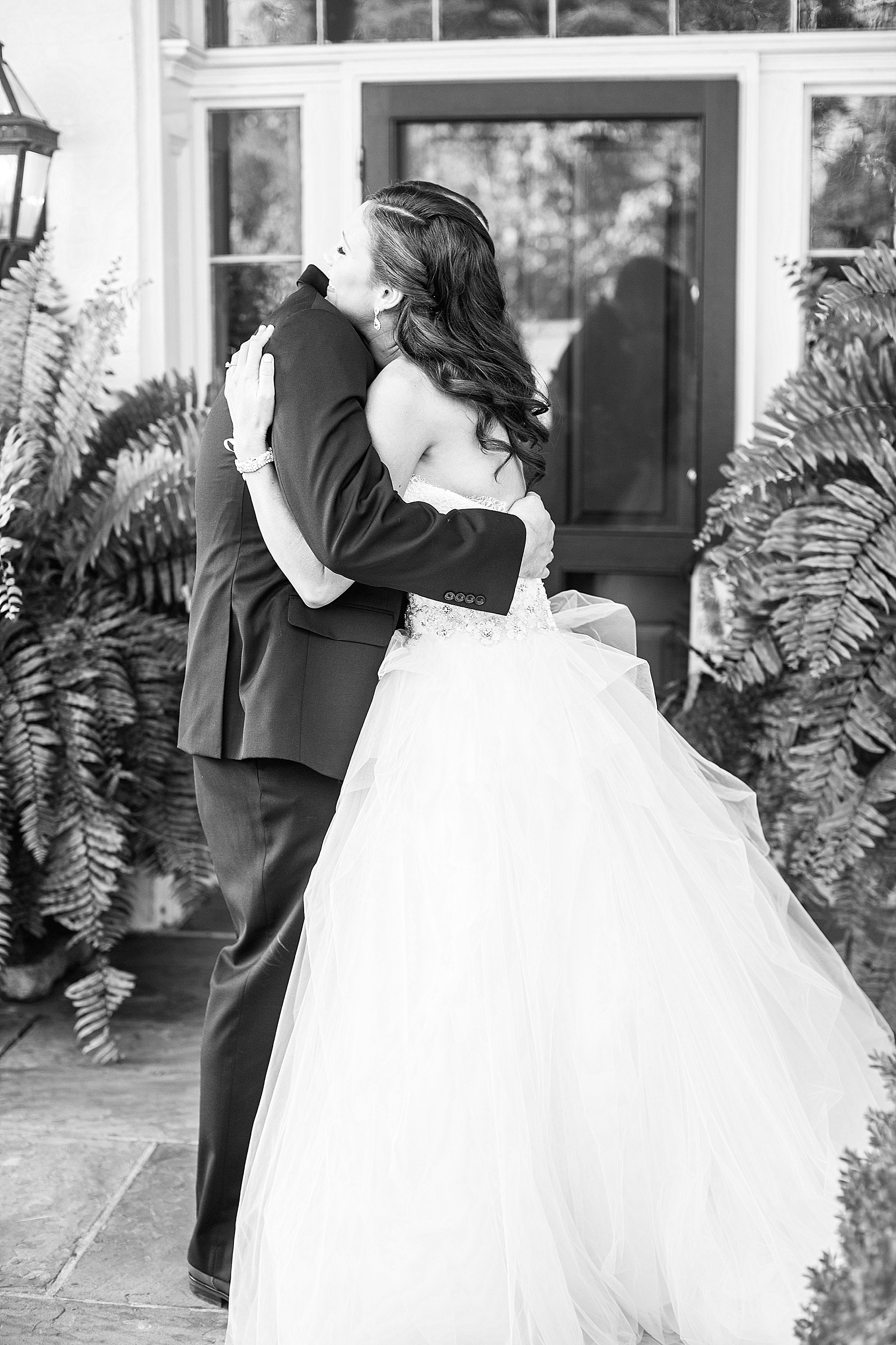 bride and groom embrace during first look at Glen Ellen Farm with Alexandra Mandato Photography