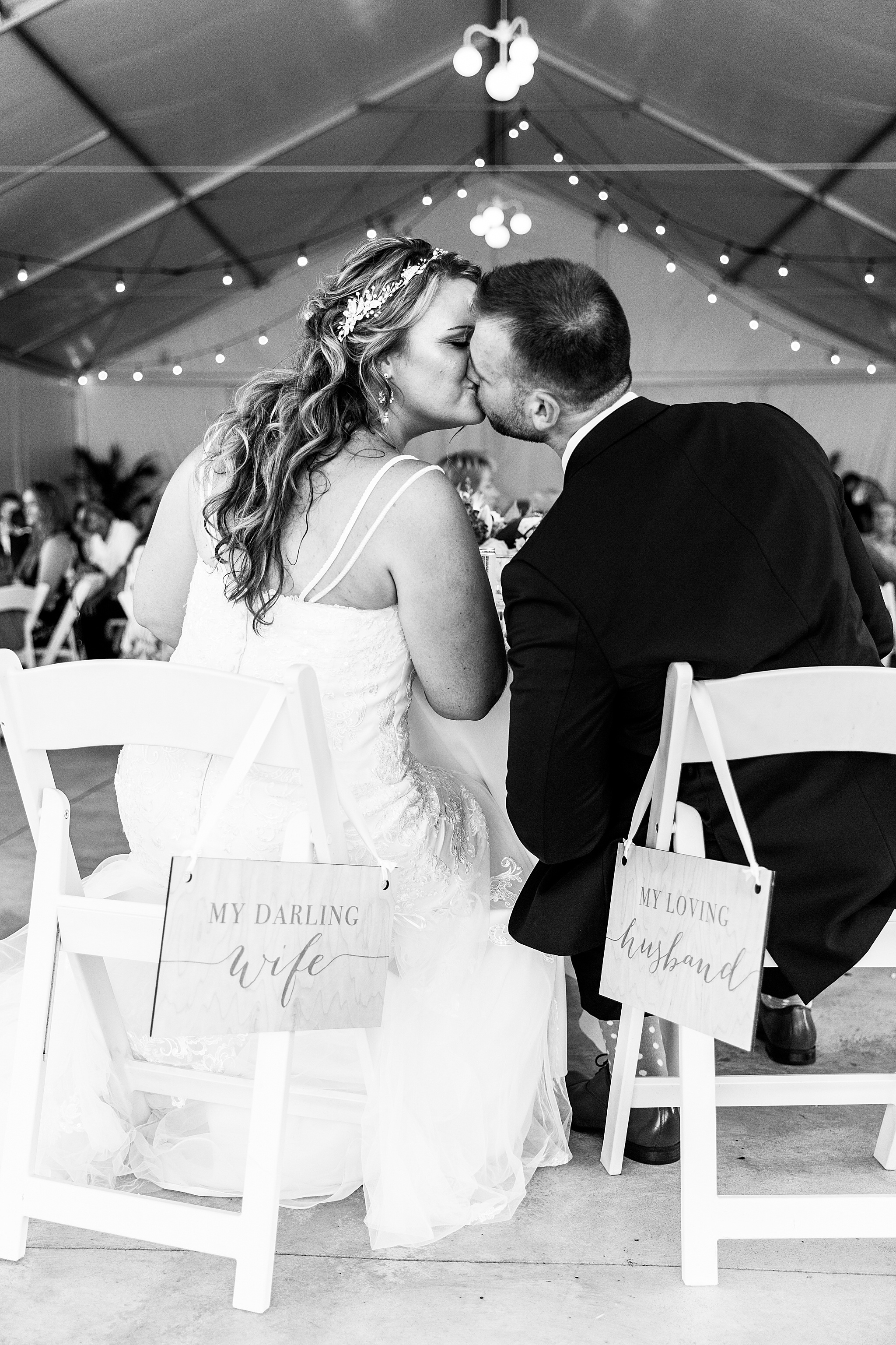 bride and groom at sweetheart table photographed by Alexandra Mandato Photography