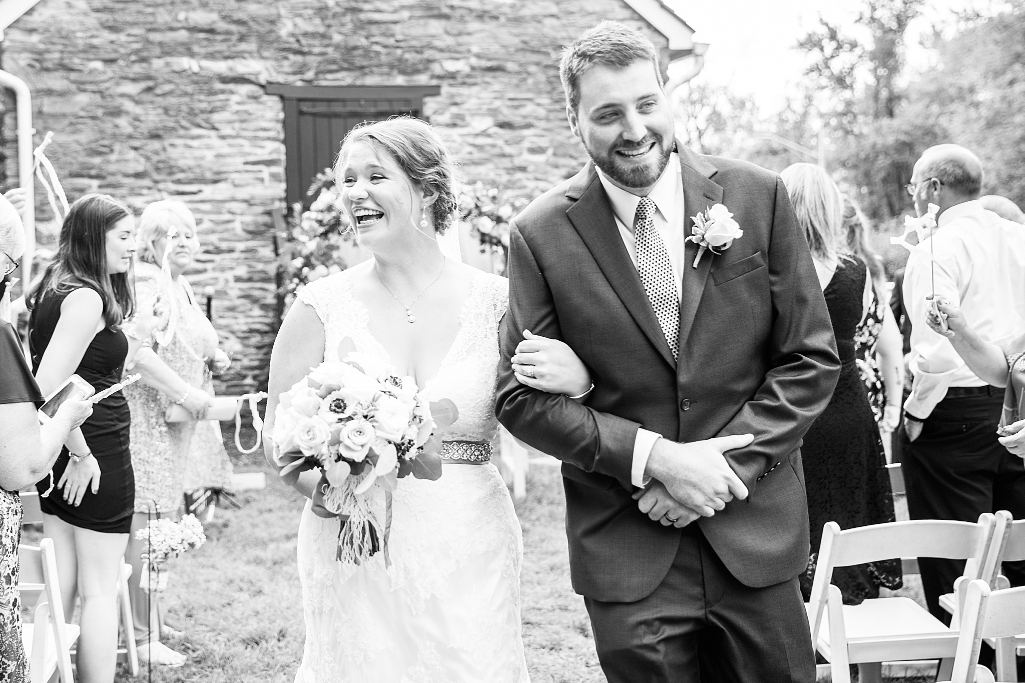 newlyweds process up aisle photographed by Alexandra Mandato Photography