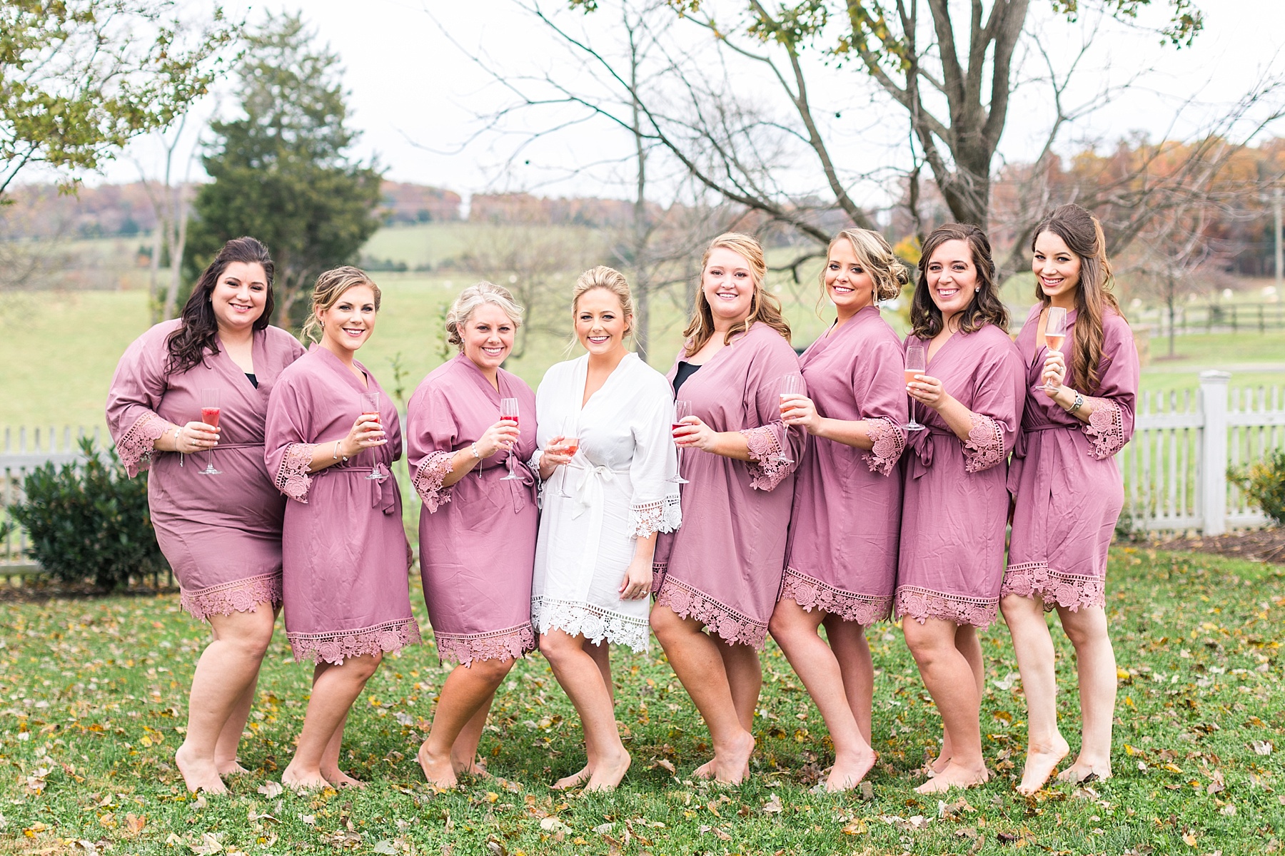 bridesmaids in pink robes prepare for Leesburg VA wedding day