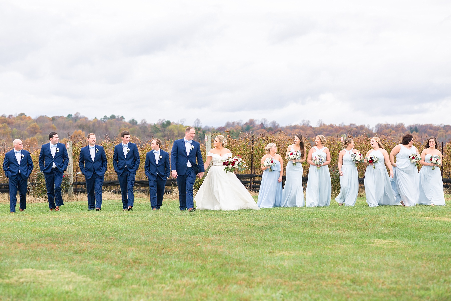 bridal party in blue photographed by  Alexandra Mandato Photography