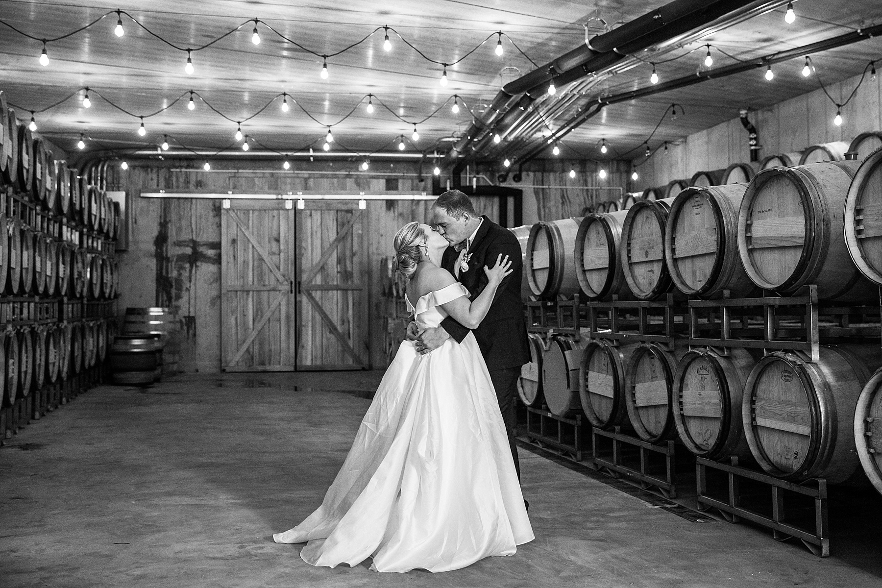 wedding portraits in barrel room at Stone Tower Winery by Alexandra Mandato Photography