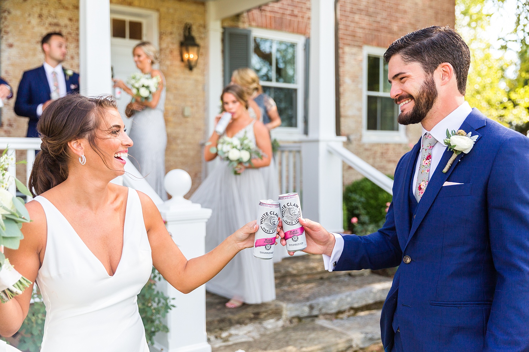 bride and groom cheers before wedding ceremony with Alexandra Mandato Photography