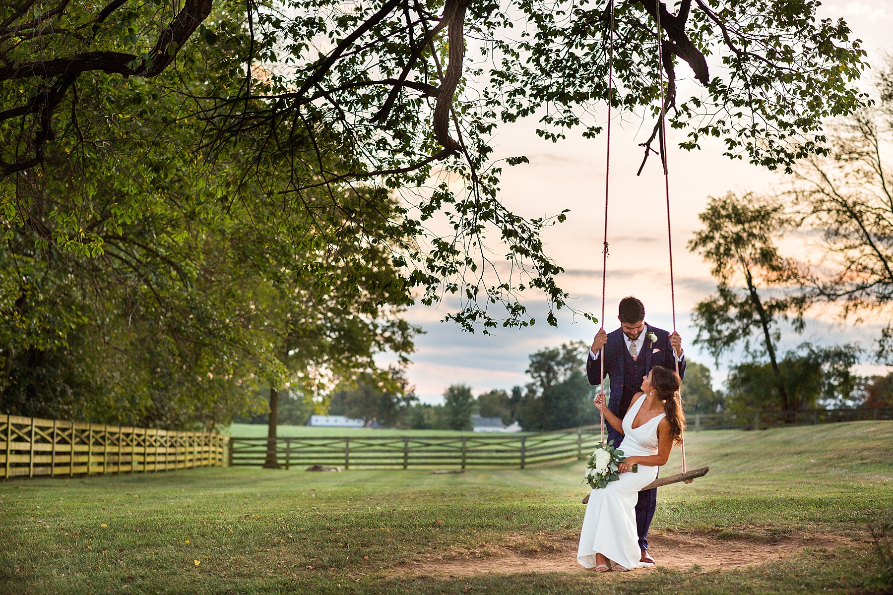 Alexandra Mandato Photography photographs wedding portraits on swing at Walker's Overlook