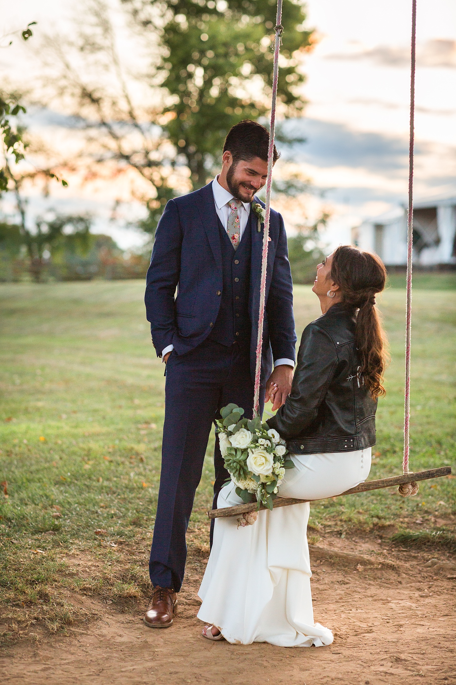 Alexandra Mandato Photography photographs bride and groom on swing