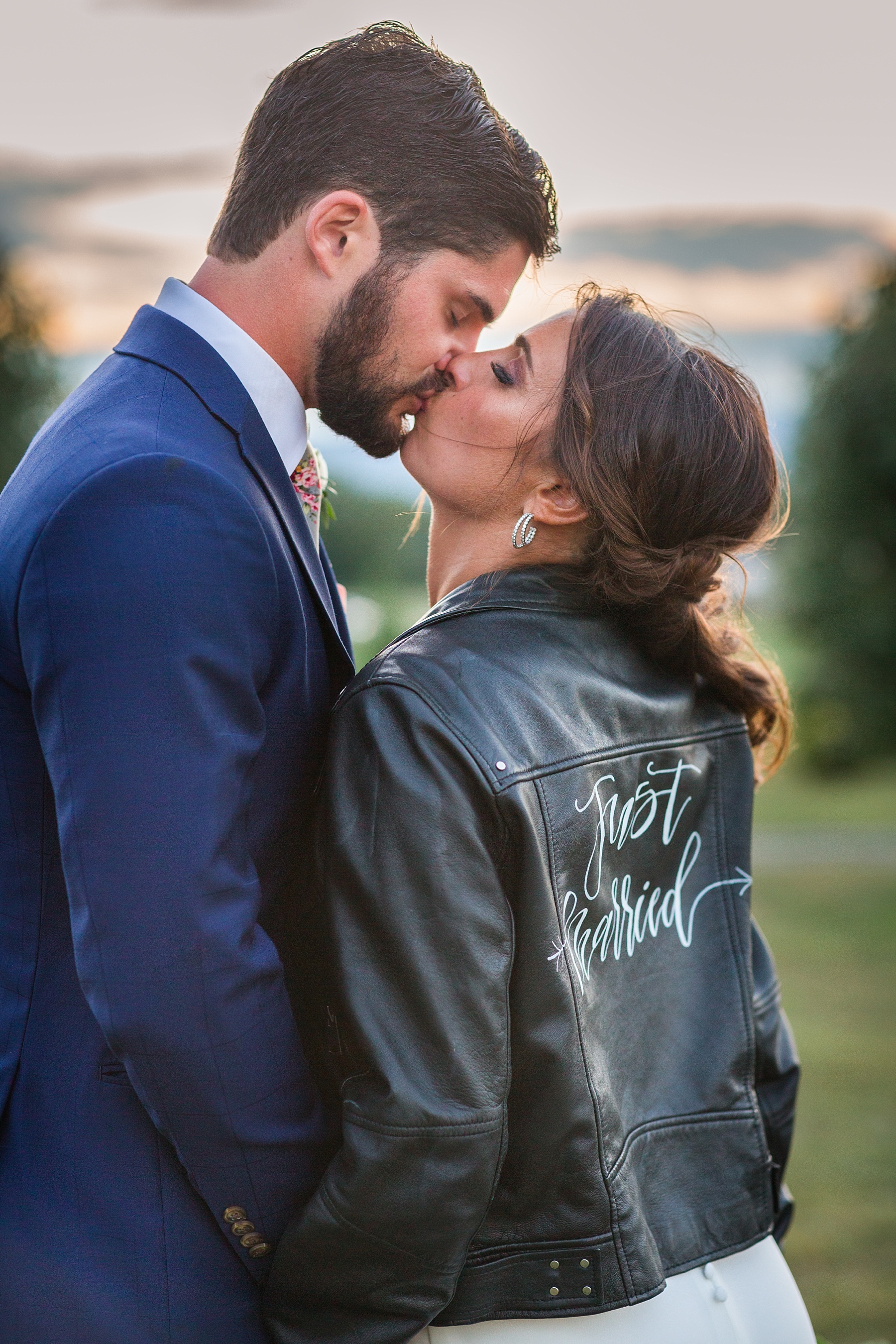 Alexandra Mandato Photography photographs bride in leather jacket at Walker's Overlook