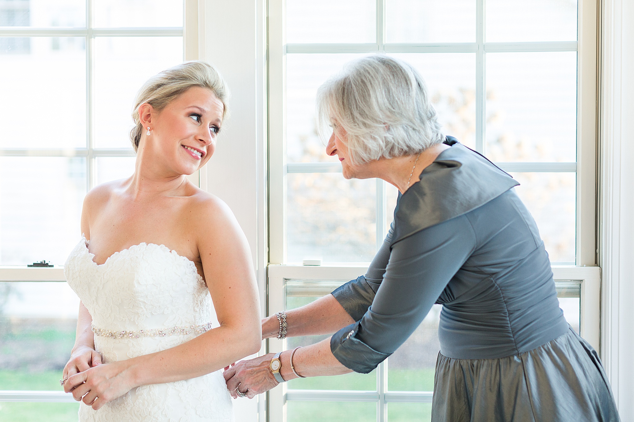 bride and mother prepare for wedding in Baltimore with Alexandra Mandato Photography