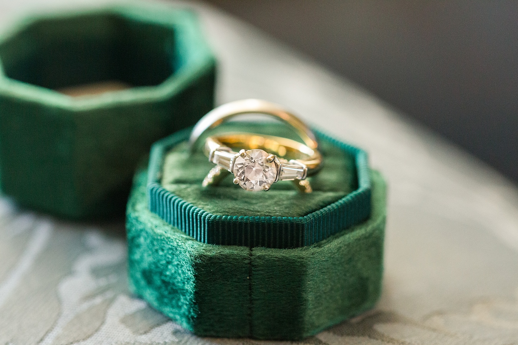 wedding ring on emerald box photographed by  Alexandra Mandato Photography