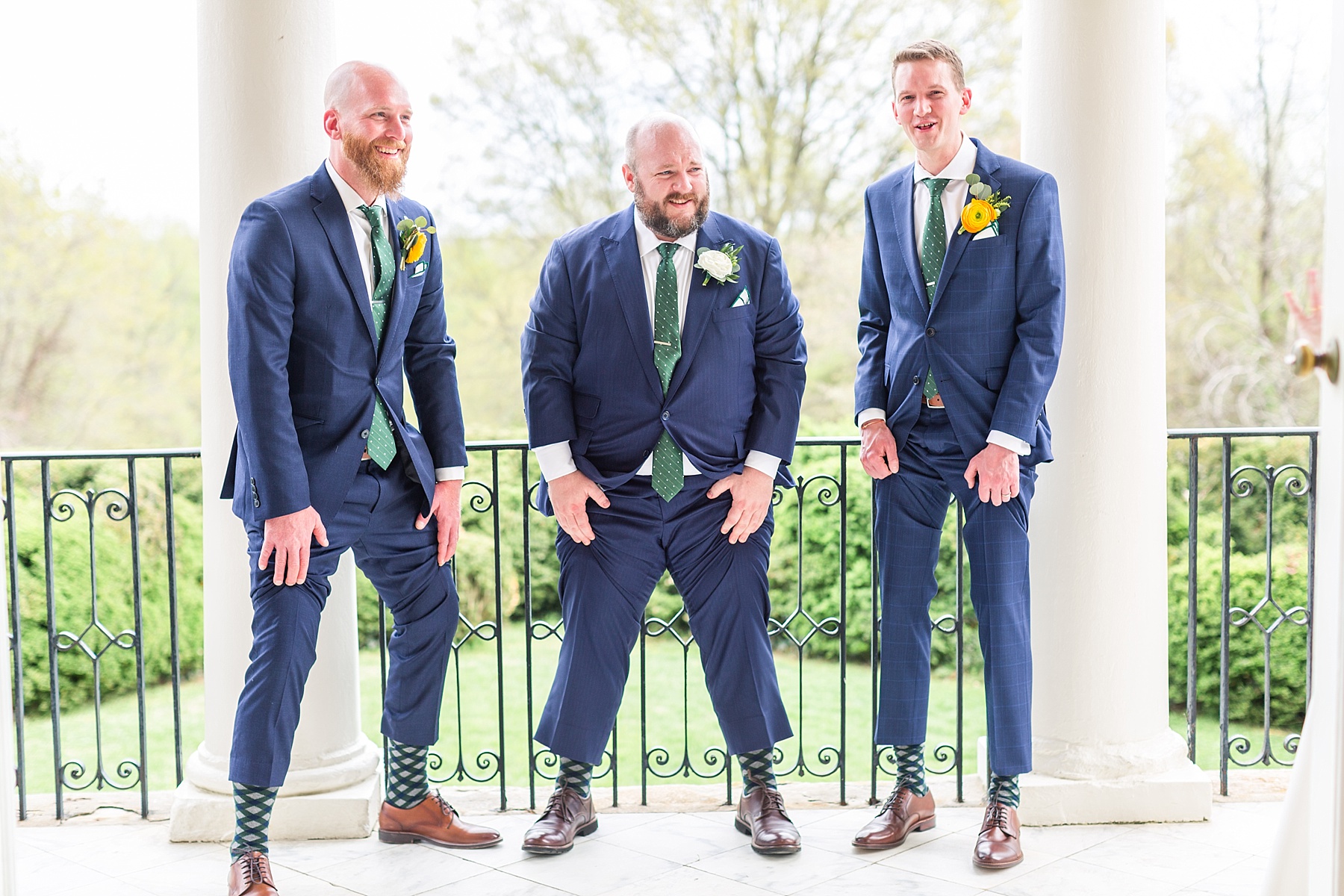 groomsmen show off socks with  Alexandra Mandato Photography