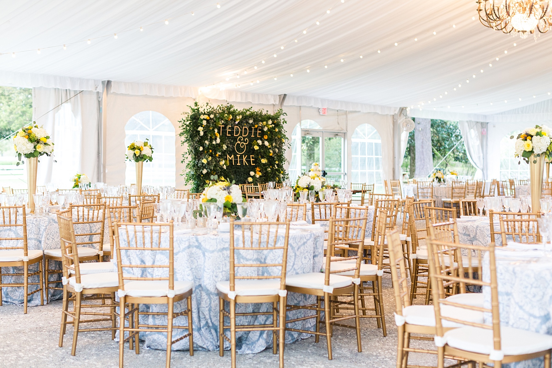 tented wedding reception with blue and ivory details photographed by Alexandra Mandato Photography