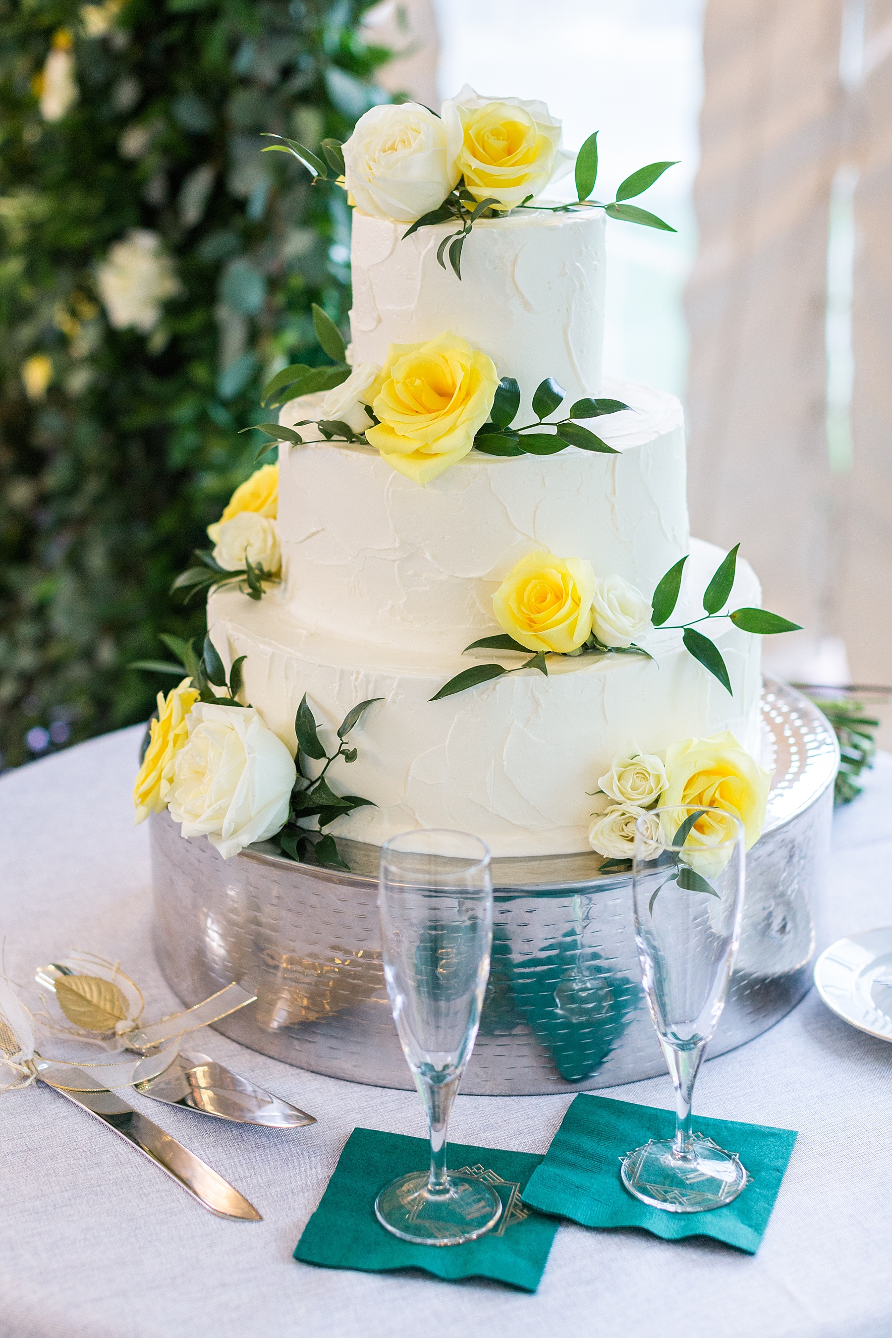 wedding cake with yellow roses photographed by Alexandra Mandato Photography
