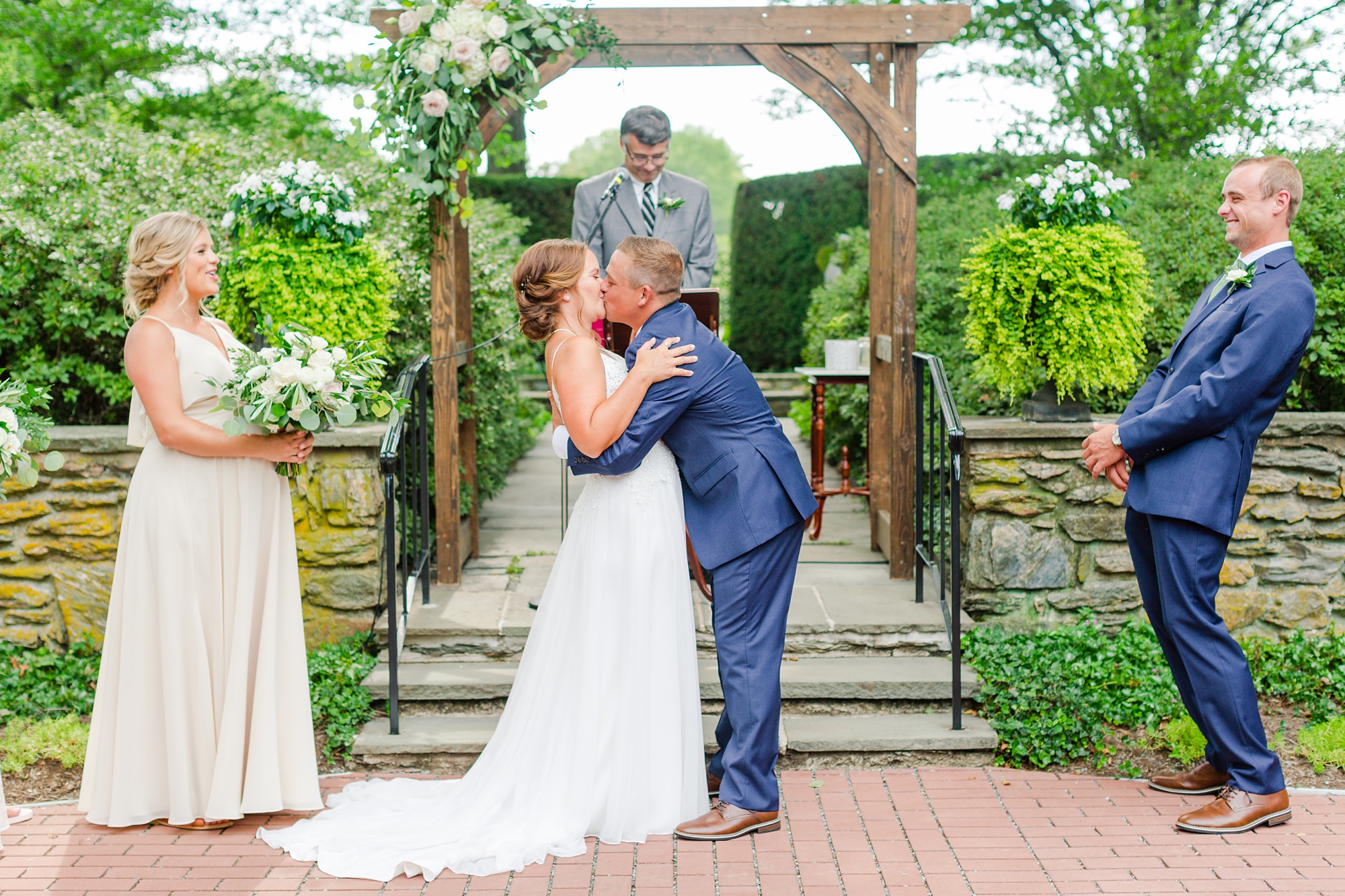 groom kisses bride during ceremony in Lancaster PA