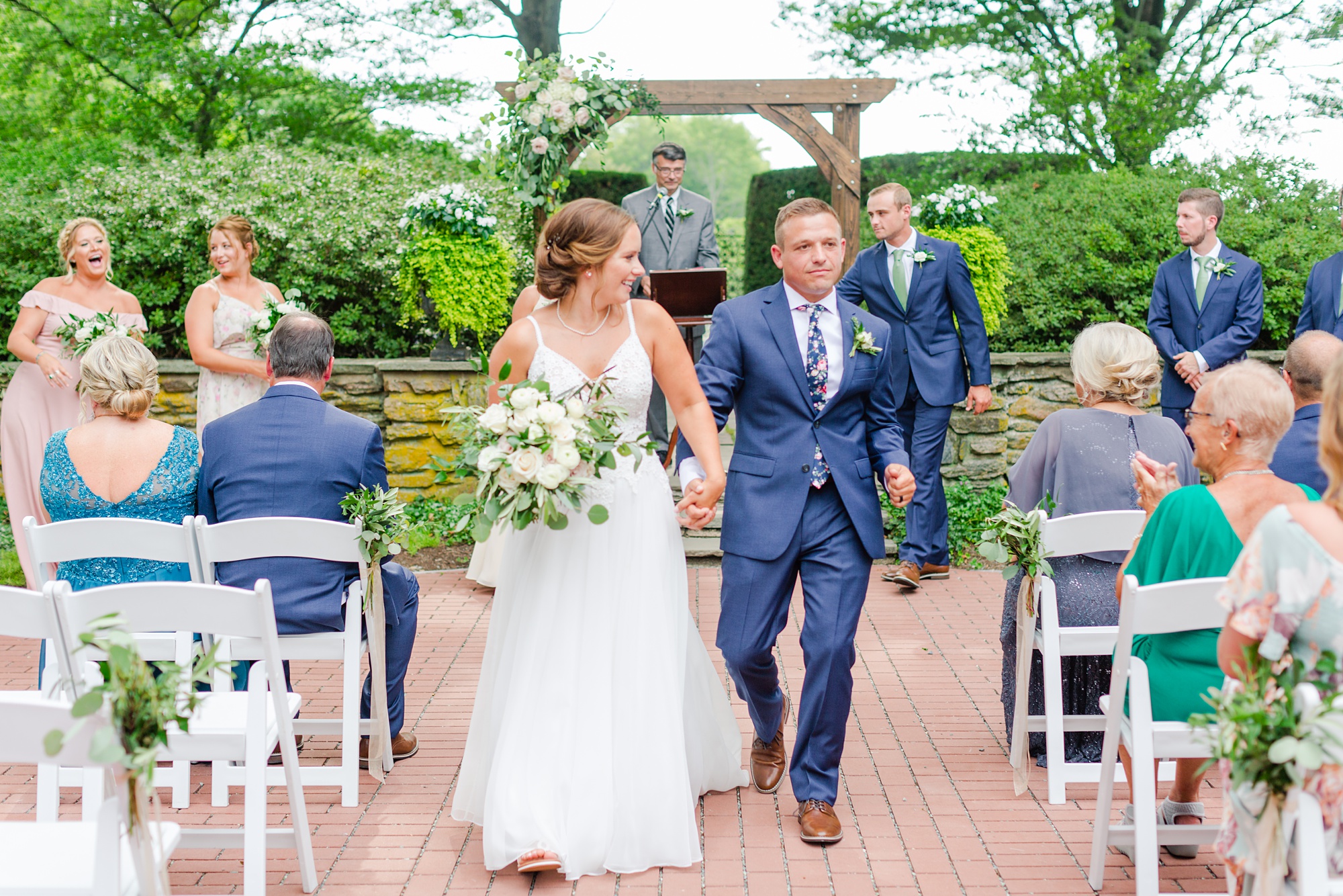 bride and groom walk up aisle after Drumore Estate ceremony 