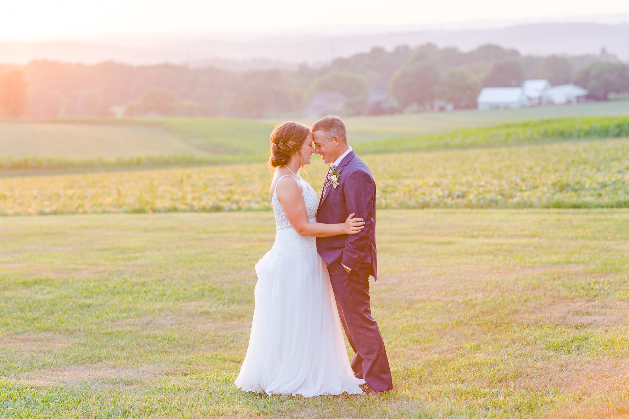sunset wedding portraits by field at Drumore Estate