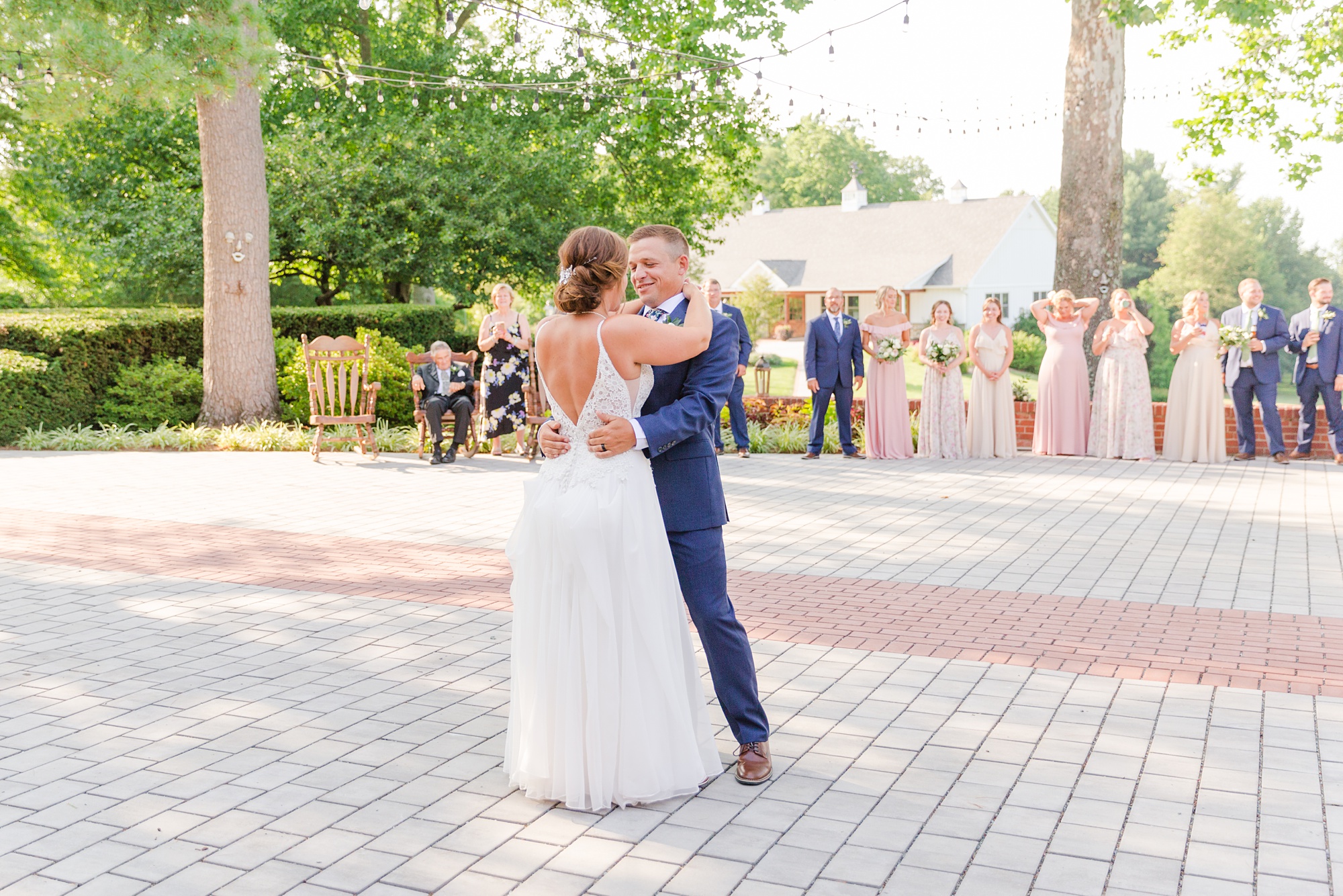 newlyweds dance on patio during Drumore Estate wedding reception