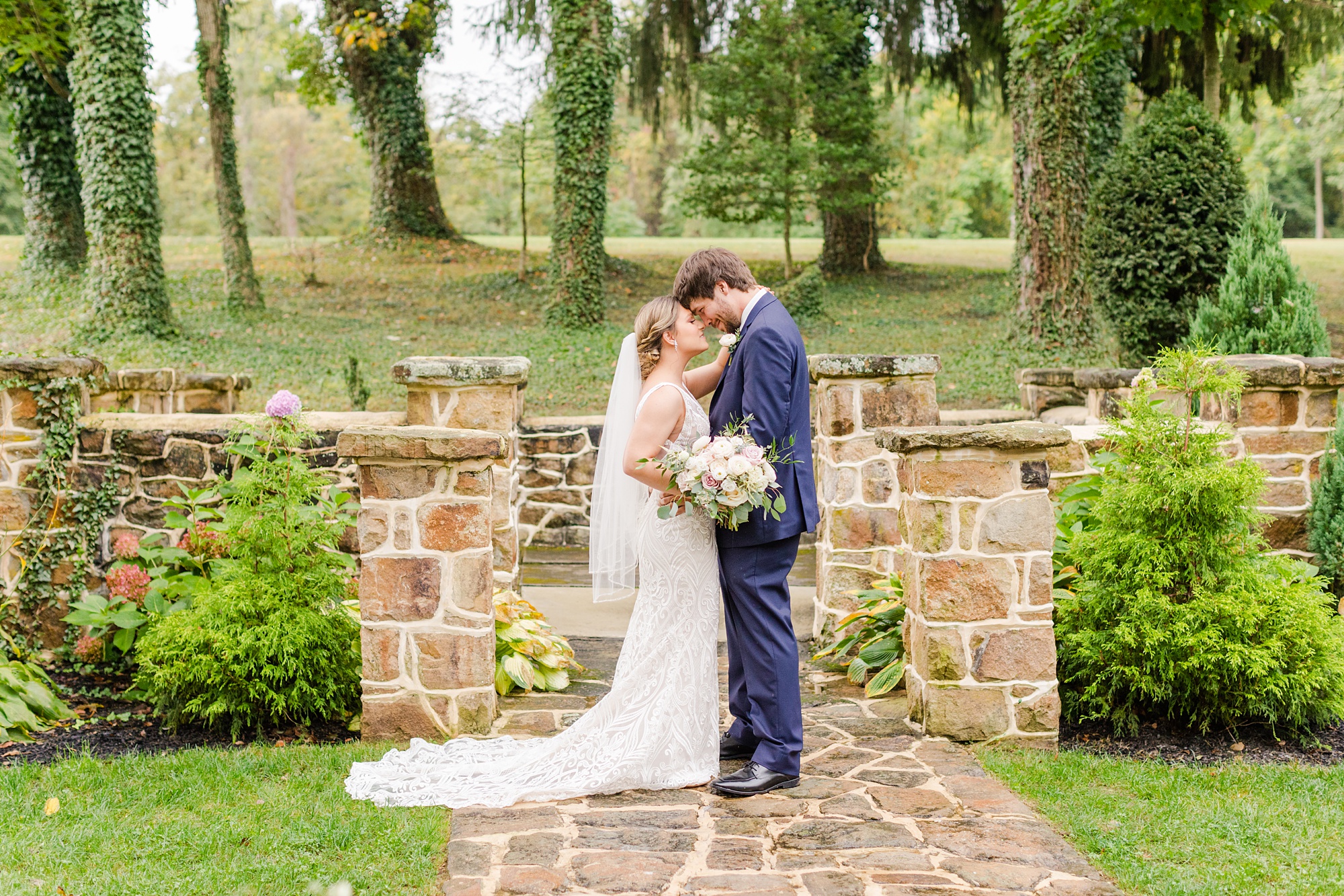 bride and groom pose on patio at Historic Shady Lane