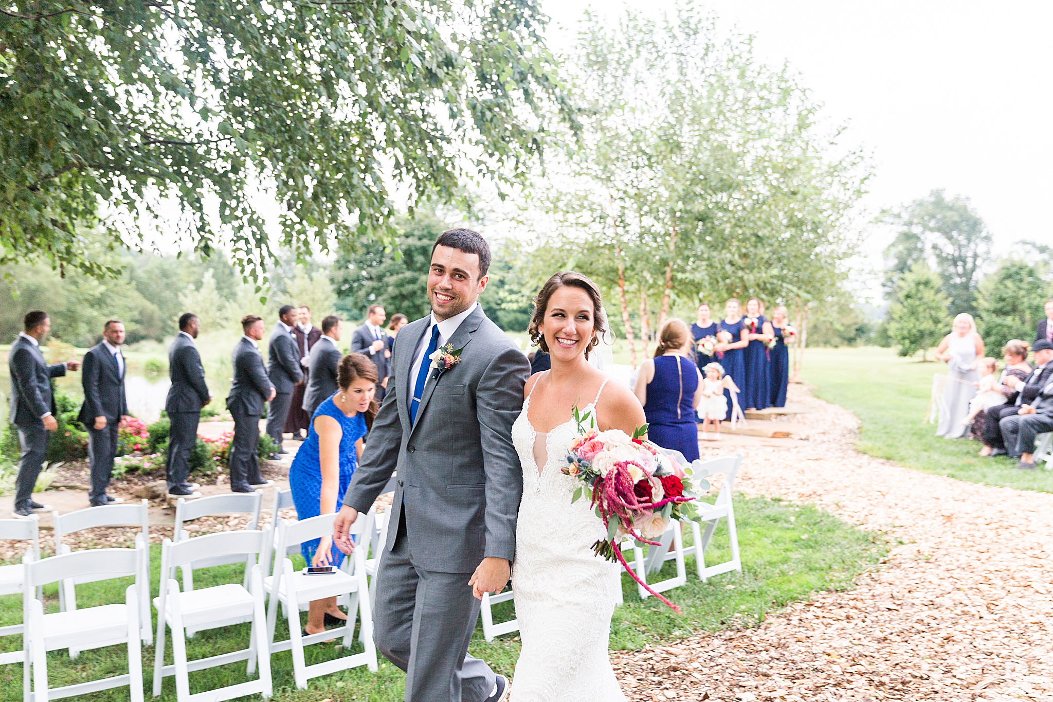 bride and groom leave ceremony photographed by Alexandra Mandato Photography