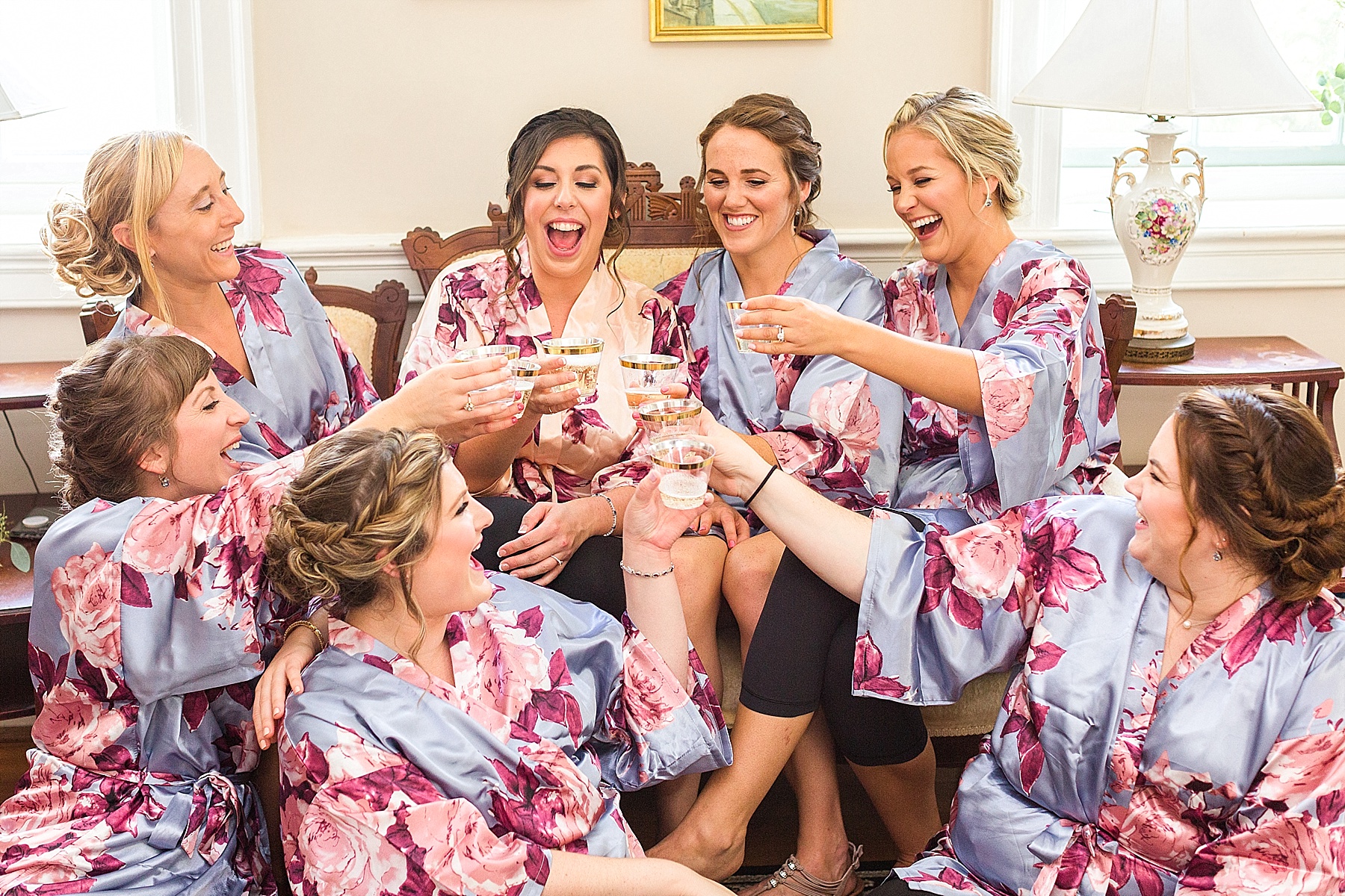 bridesmaids cheer before wedding in Maryland with Alexandra Mandato Photography