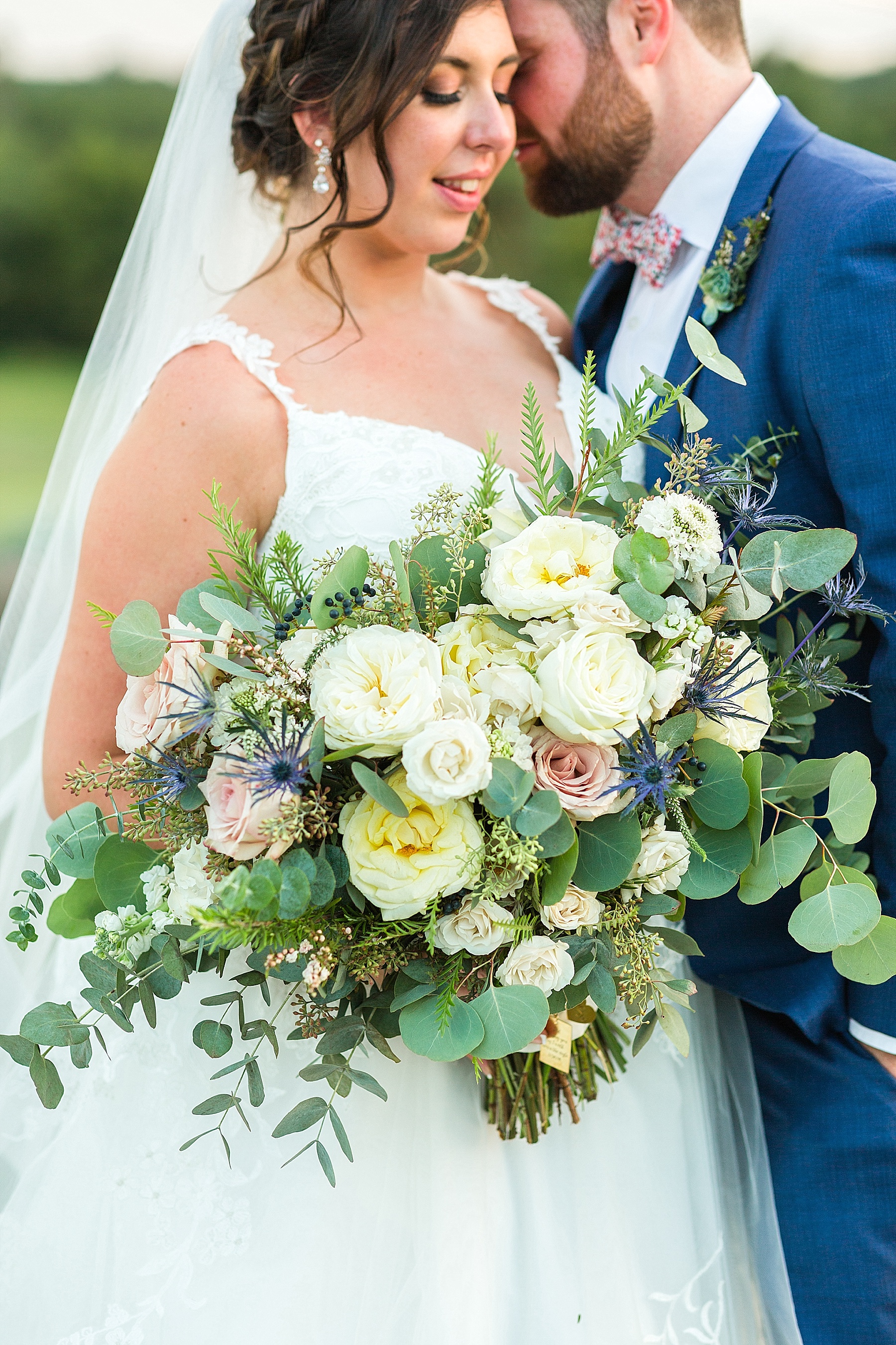 wedding bouquet with ivory florals photographed by Alexandra Mandato Photography