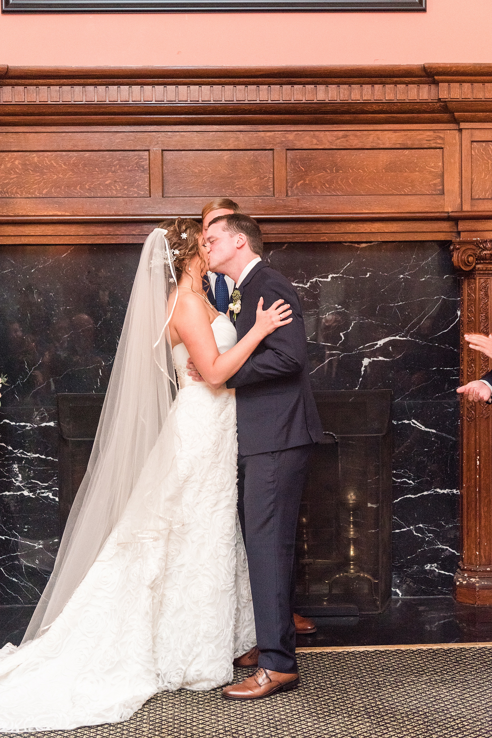 first kiss with bride and groom photographed by Alexandra Mandato Photography