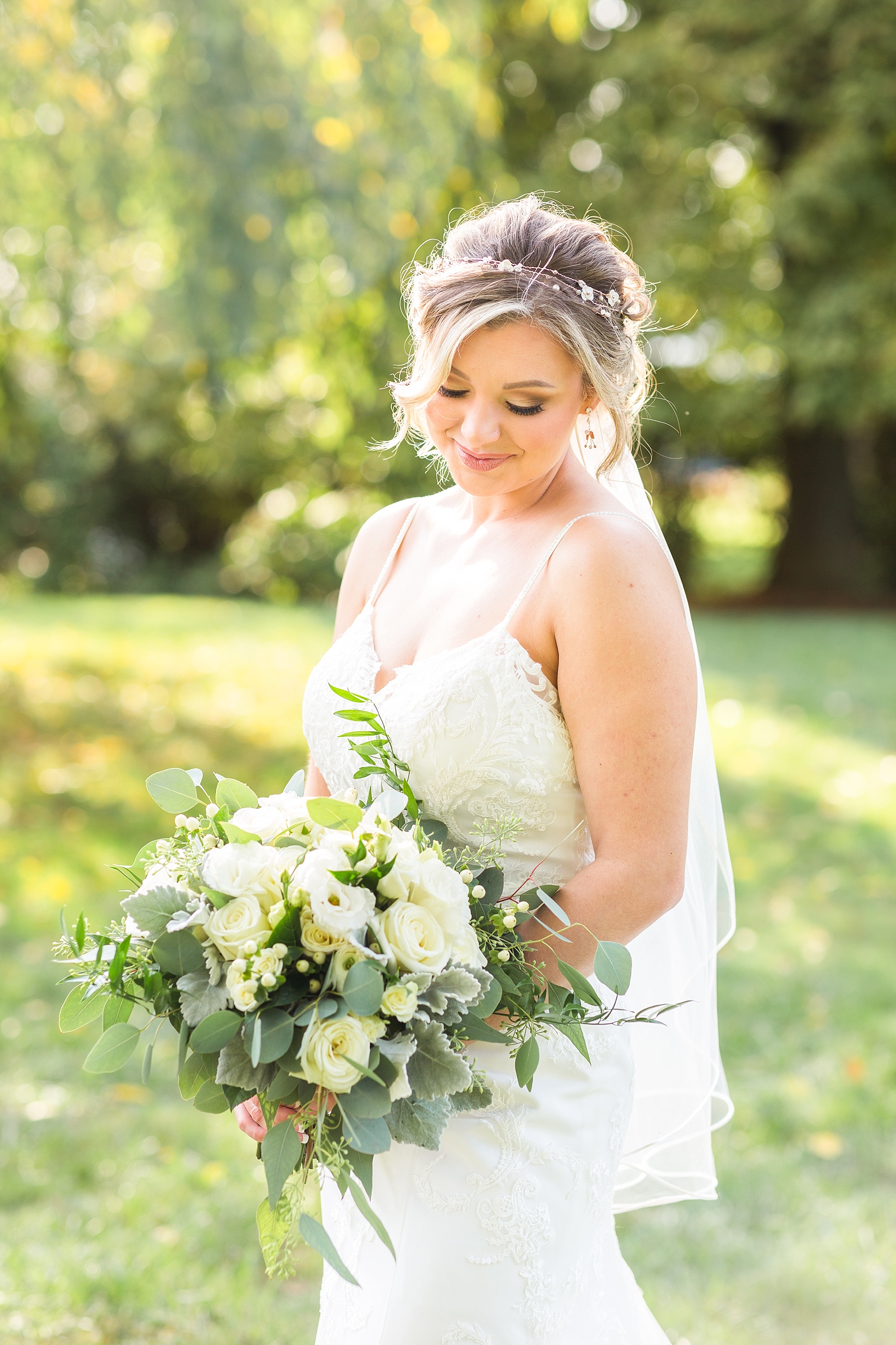 Alexandra Mandato Photography photographs bride with ivory bouquet