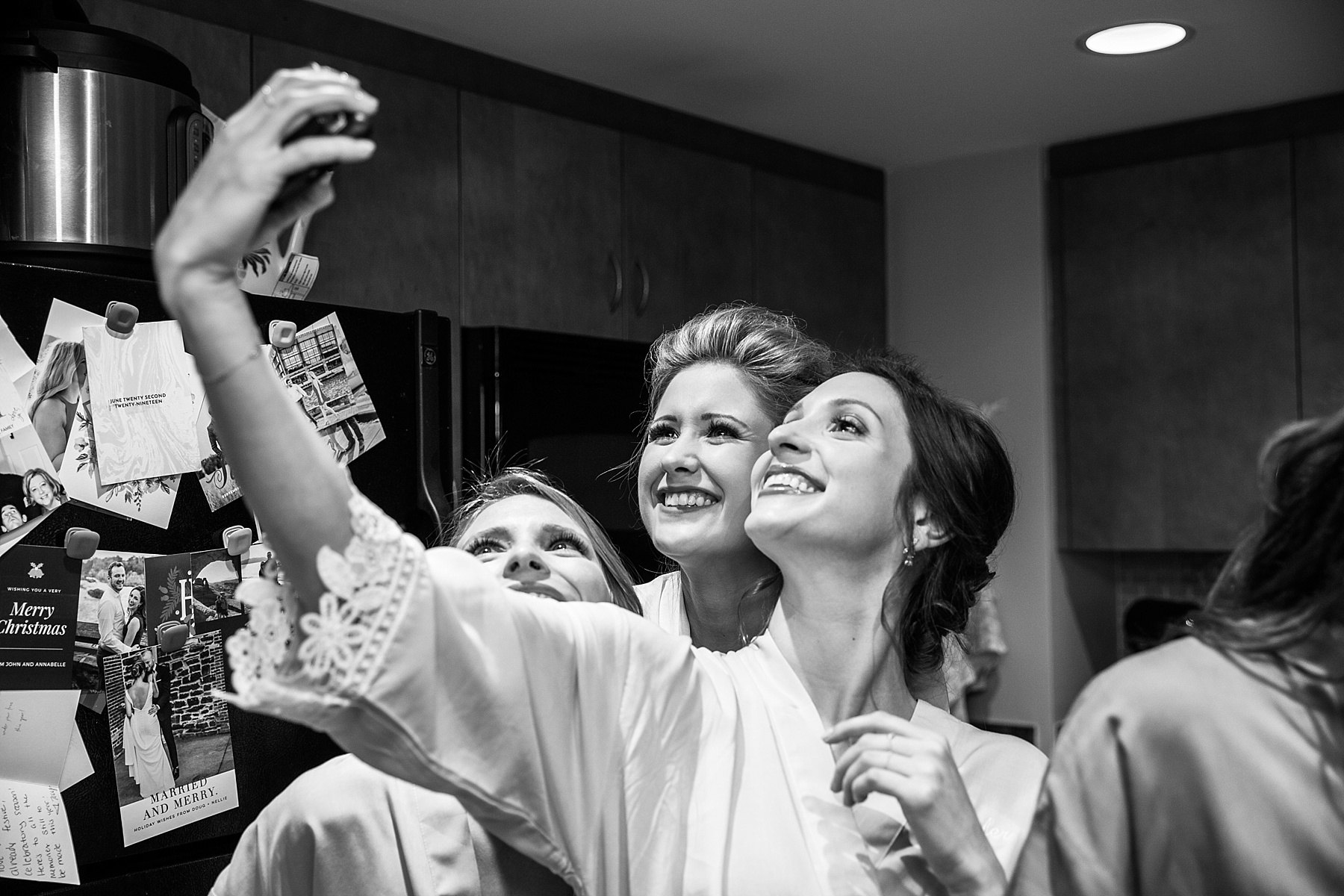 bridesmaids take selfie during wedding prep