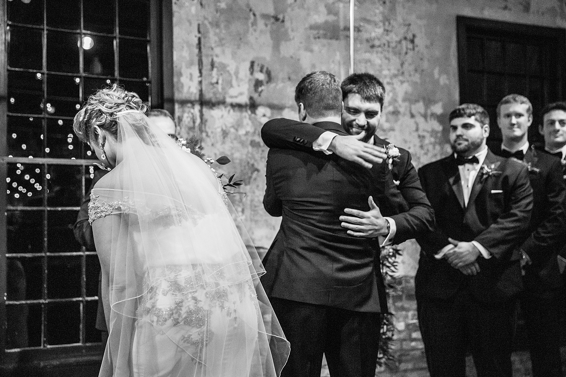 father gives bride away during Baltimore wedding ceremony photographed by Alexandra Mandato Photography