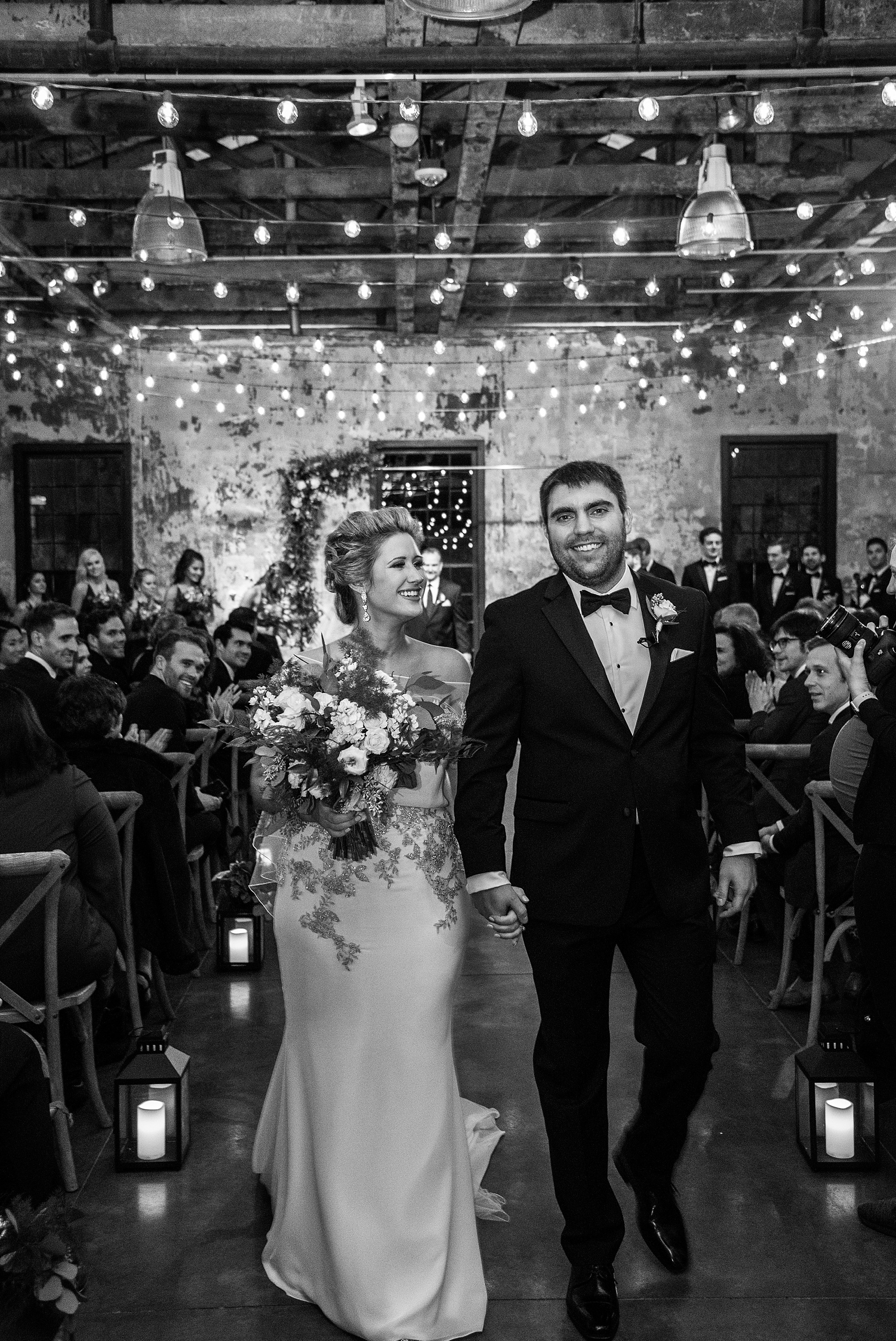 bride and groom walk up aisle photographed by Alexandra Mandato Photography