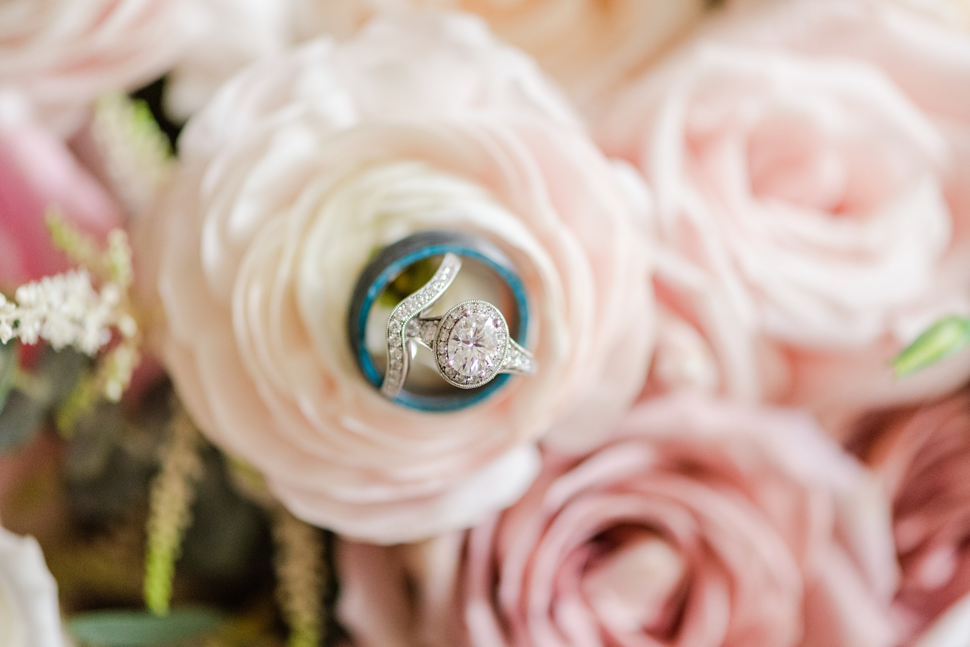 diamond ring on pale pink flowers before Romantic Historic Shady Lane Wedding
