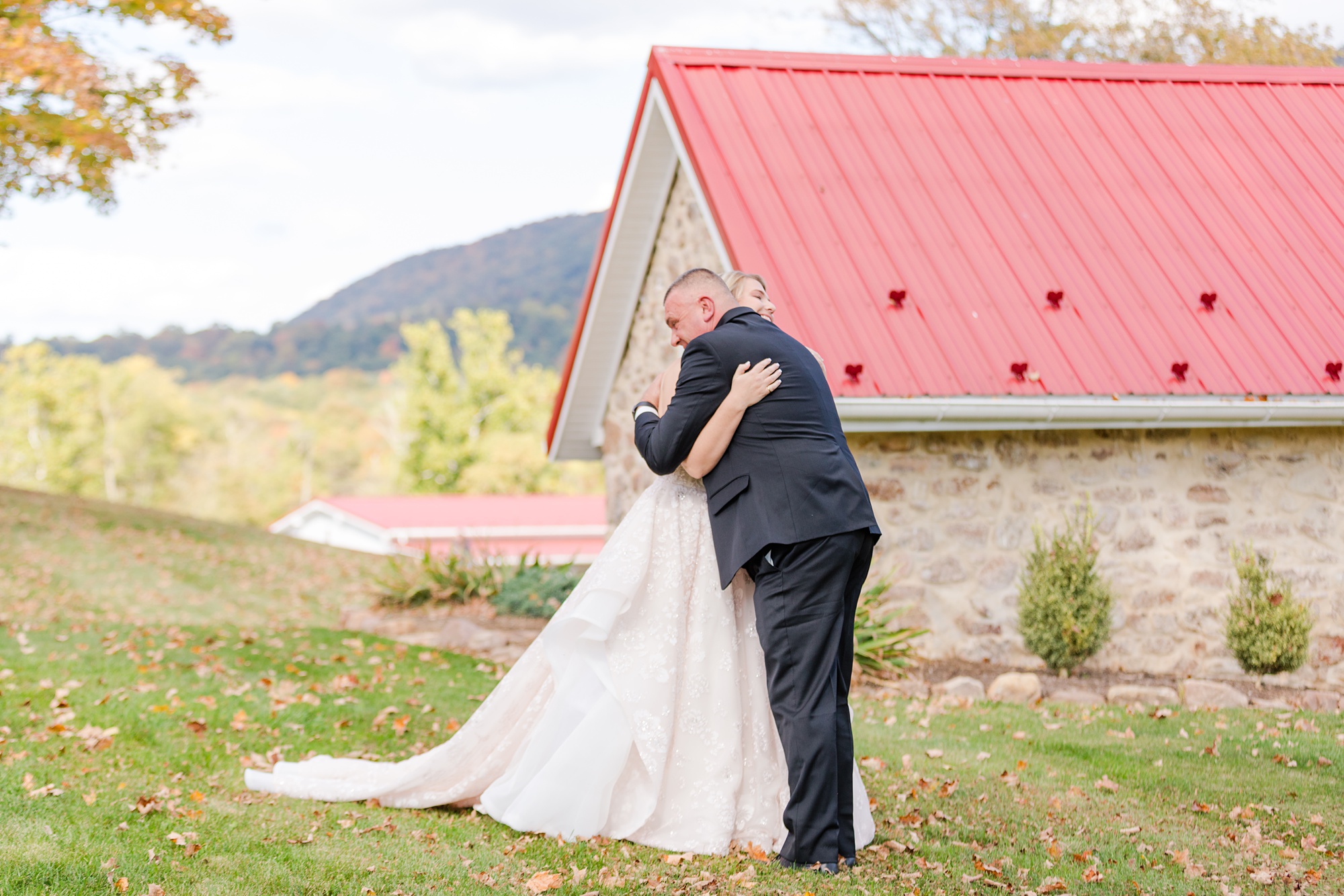 bride and father hug during first look