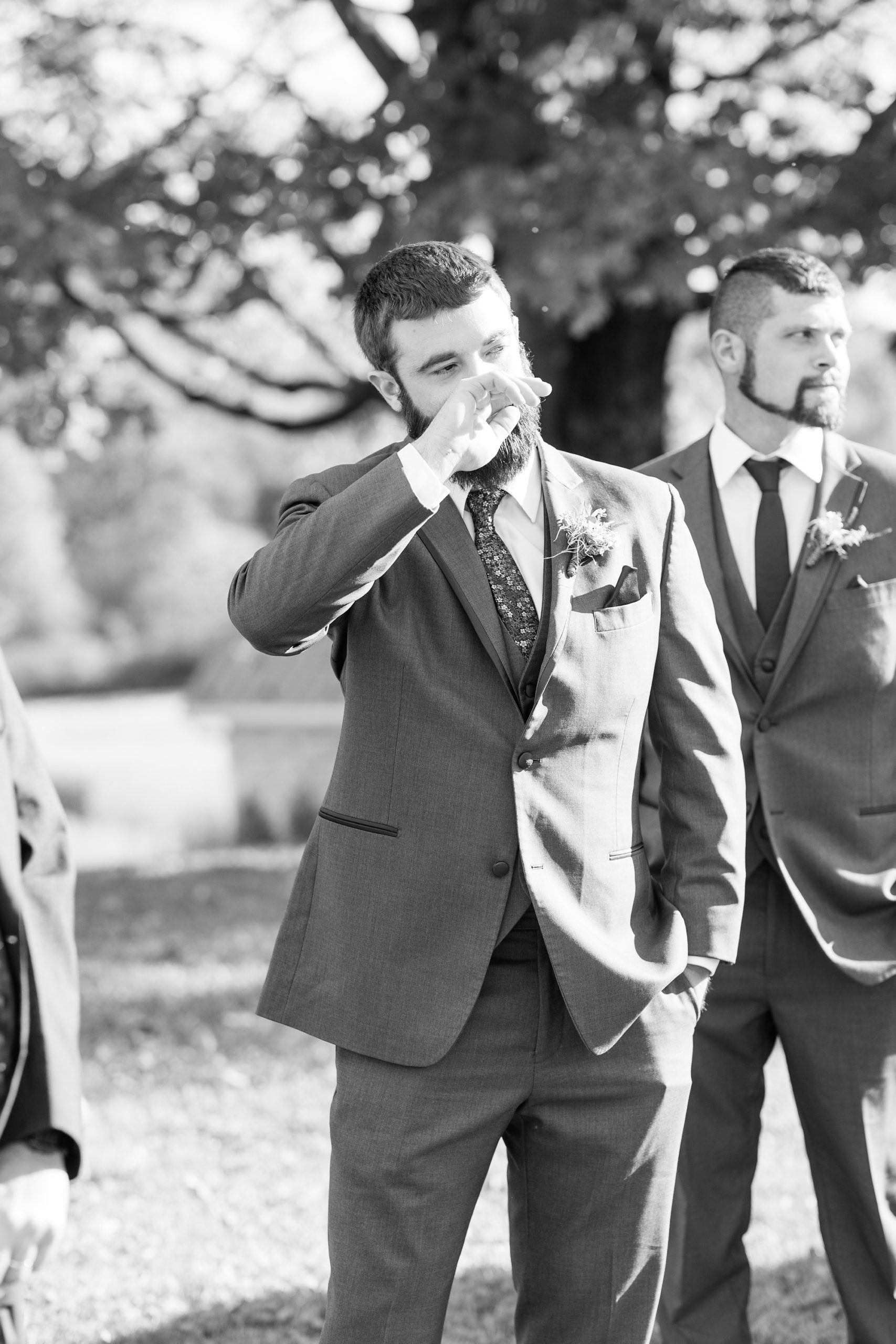 groom cries while bride walks towards him at Iron Works House ceremony 