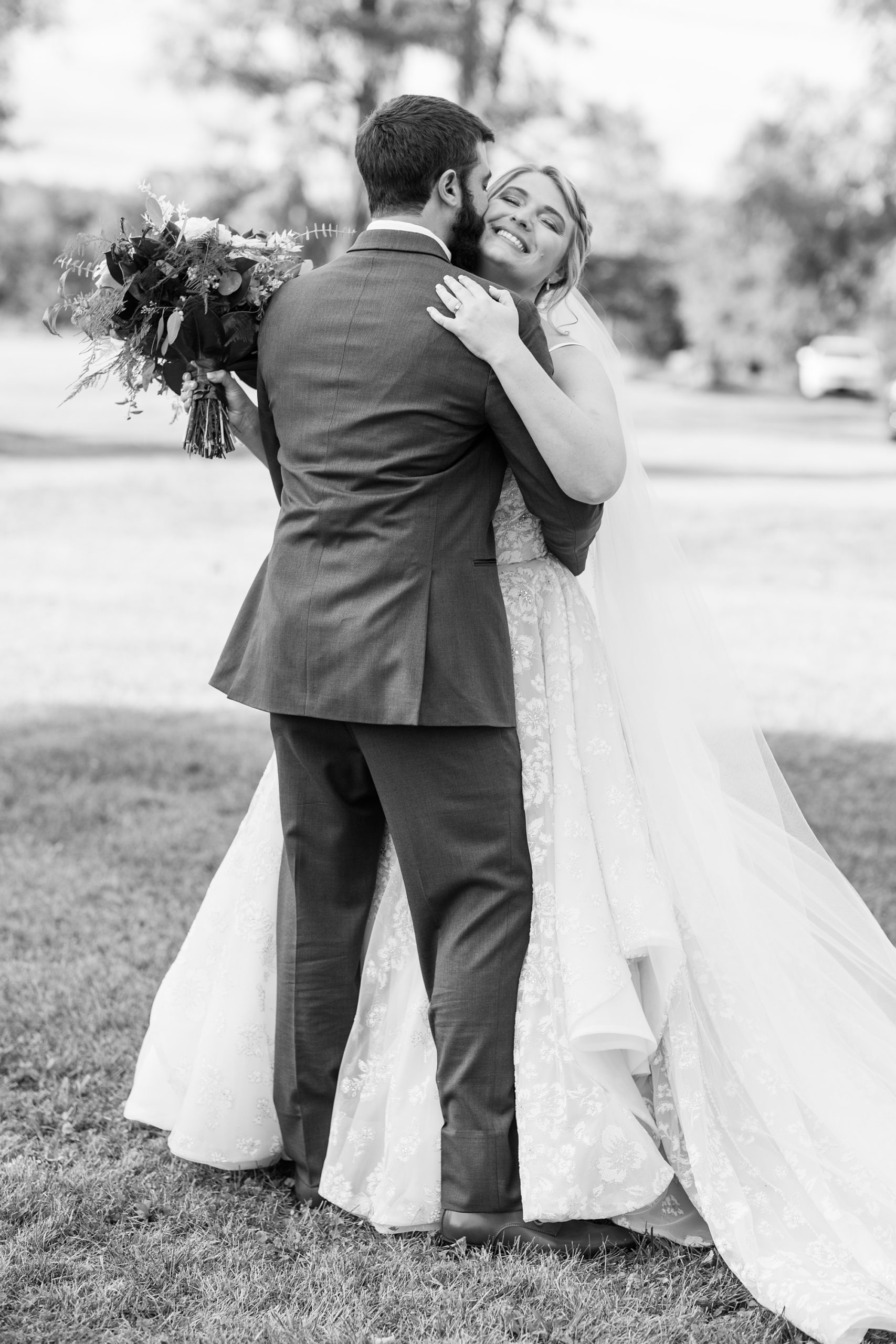 bride and groom hug after wedding ceremony