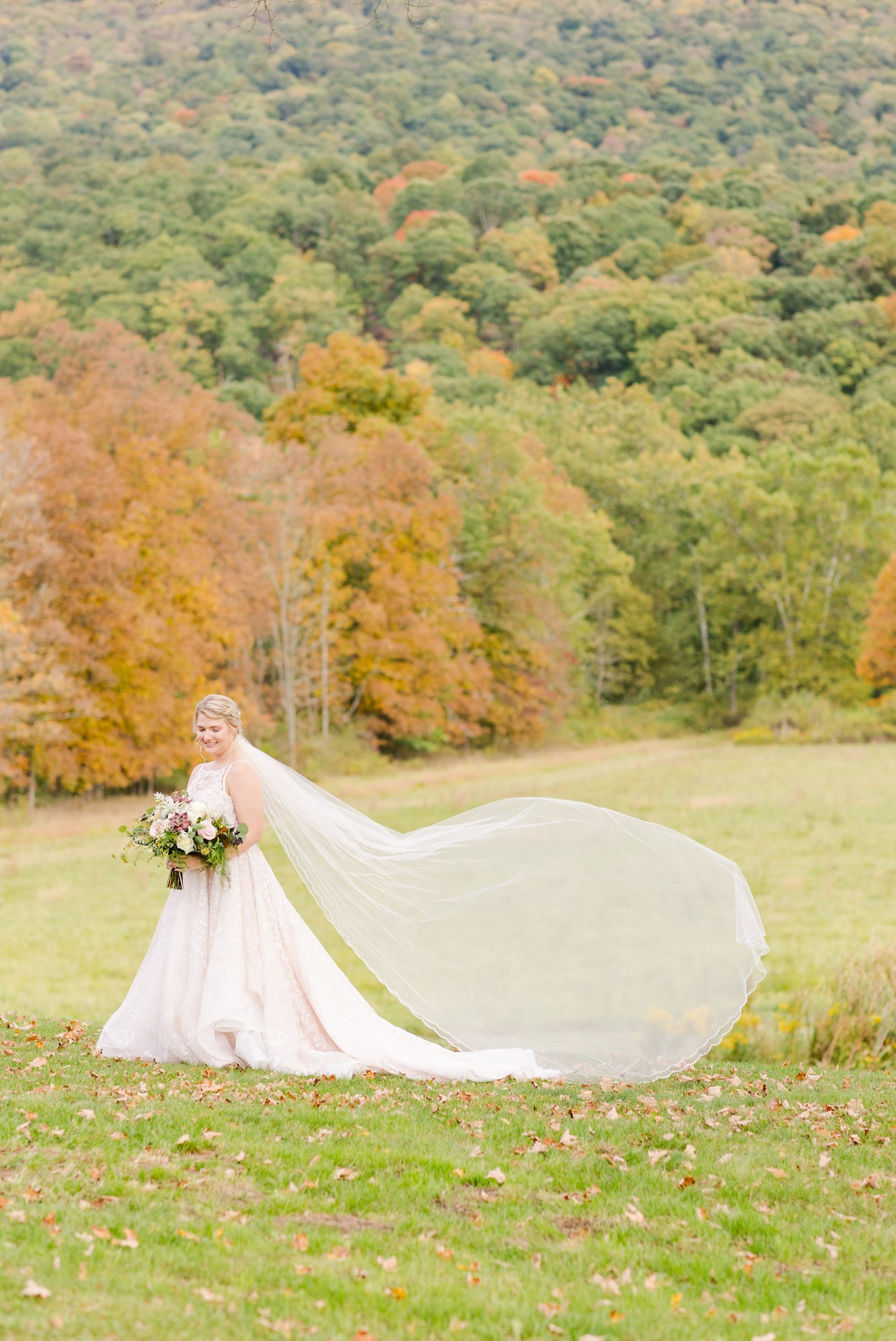 bridal portrait with veil floating behind bride