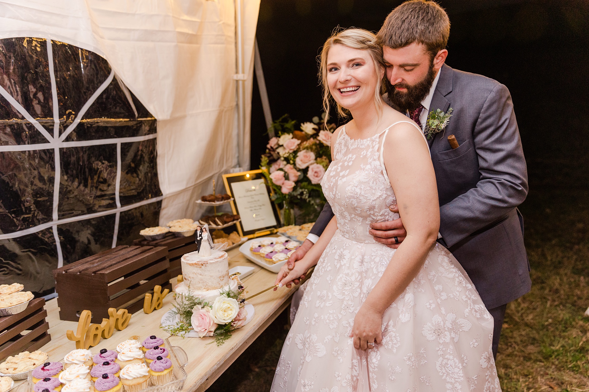 newlyweds cut wedding cake during PA wedding reception